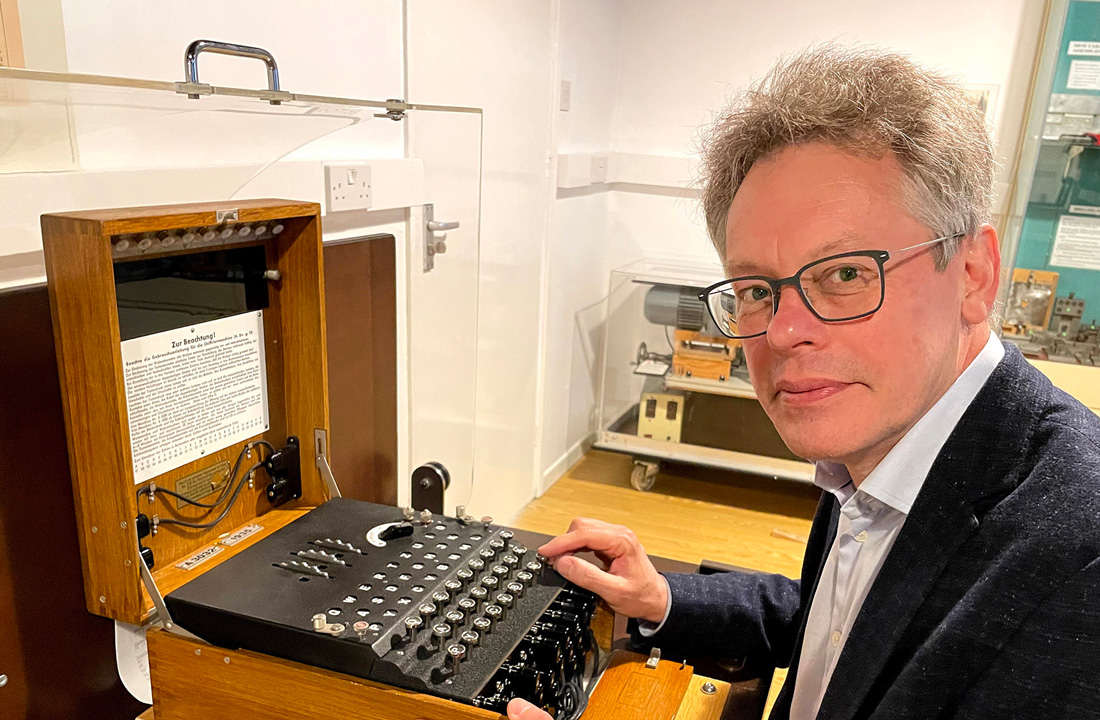 Dermot Turing with Enigma machine. Photo by KT Bruce